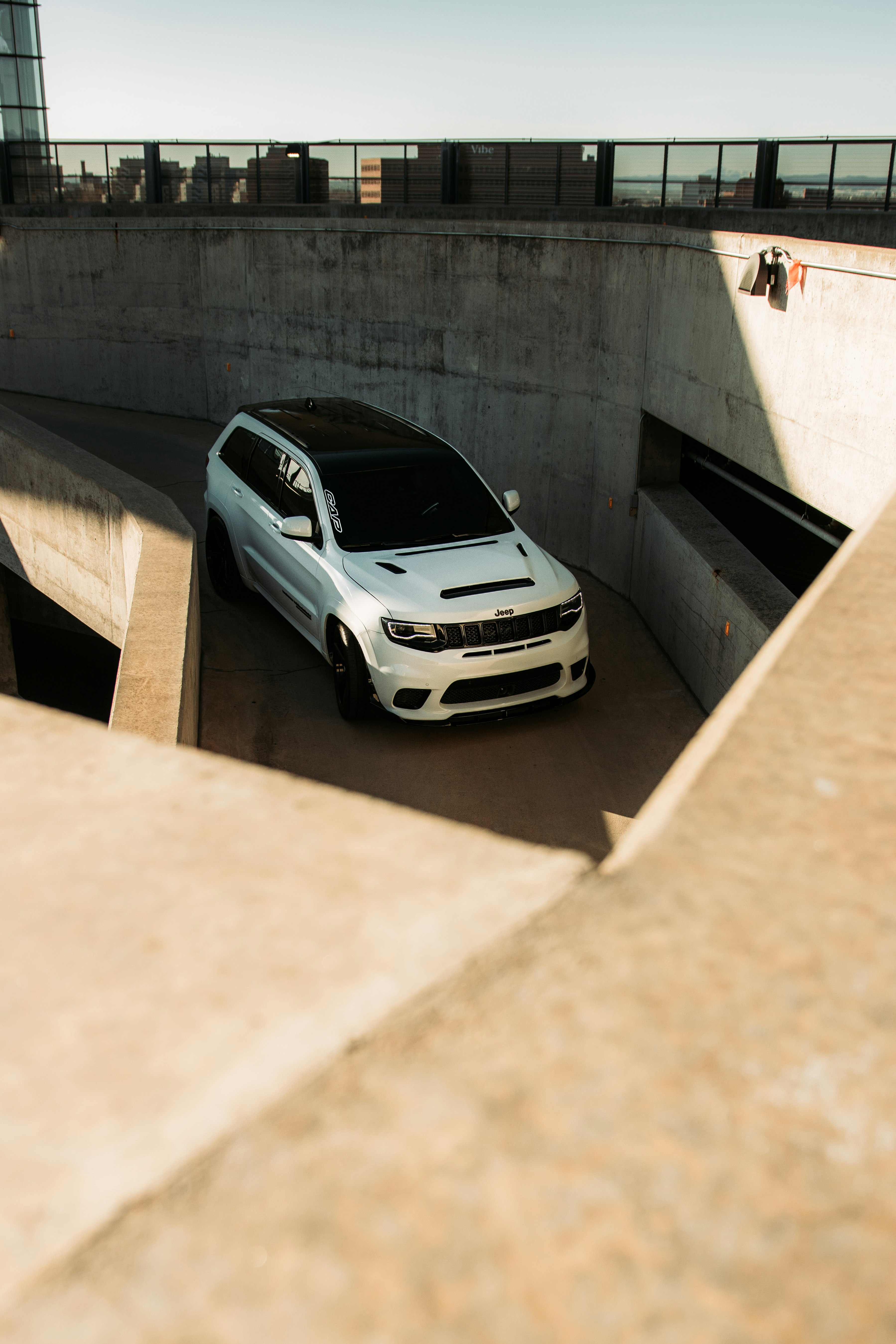 white car parked on gray concrete floor